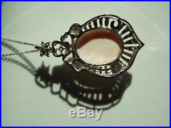 Master hand carved sardonyx cameo set into sterling silver pendant with cubic