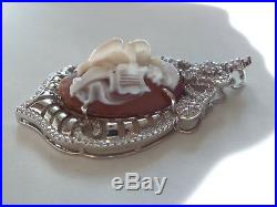 Master hand carved sardonyx cameo set into sterling silver pendant with cubic